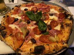 Pizzeria, Cozaio, on, Finchley, Road, is, a, charming, eatery, known, for, its, delicious, pizzas, and, welcoming, atmosphere. The, restaurant, offers, a, variety, of, traditional, and, creative, pizza, options, made, with, high-quality, ingredients, and, cooked, to, perfection. Guests, can, enjoy, a, range, of, classic, toppings, as, well, as, unique, combinations, all, prepared, in, a, cozy, and, inviting, setting. Whether, you're, craving, a, simple, margherita, or, an, adventurous, gourmet, pizza, Pizzeria, Cozaio, provides, a, delightful, dining, experience, right, on, Finchley, Road