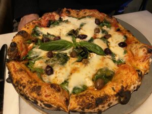 Pizzeria, Cozaio, on, Finchley, Road, is, a, charming, eatery, known, for, its, delicious, pizzas, and, welcoming, atmosphere. The, restaurant, offers, a, variety, of, traditional, and, creative, pizza, options, made, with, high-quality, ingredients, and, cooked, to, perfection. Guests, can, enjoy, a, range, of, classic, toppings, as, well, as, unique, combinations, all, prepared, in, a, cozy, and, inviting, setting. Whether, you're, craving, a, simple, margherita, or, an, adventurous, gourmet, pizza, Pizzeria, Cozaio, provides, a, delightful, dining, experience, right, on, Finchley, Road