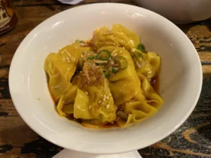 Spicy wontons served in chilli oil at Leong’s Legend London.