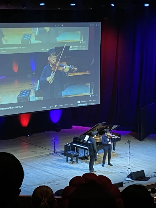 TwoSet-Violin-performing-live-on-stage-at-the-Barbican