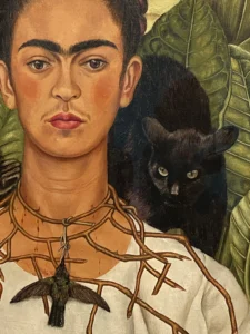 Frida Kahlo self-portrait with a black cat displayed at Tate Modern