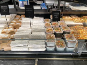 Prepared-food counter inside Harrods Fresh Market Hall