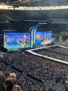 Harry Styles performing at Wembley Stadium in London