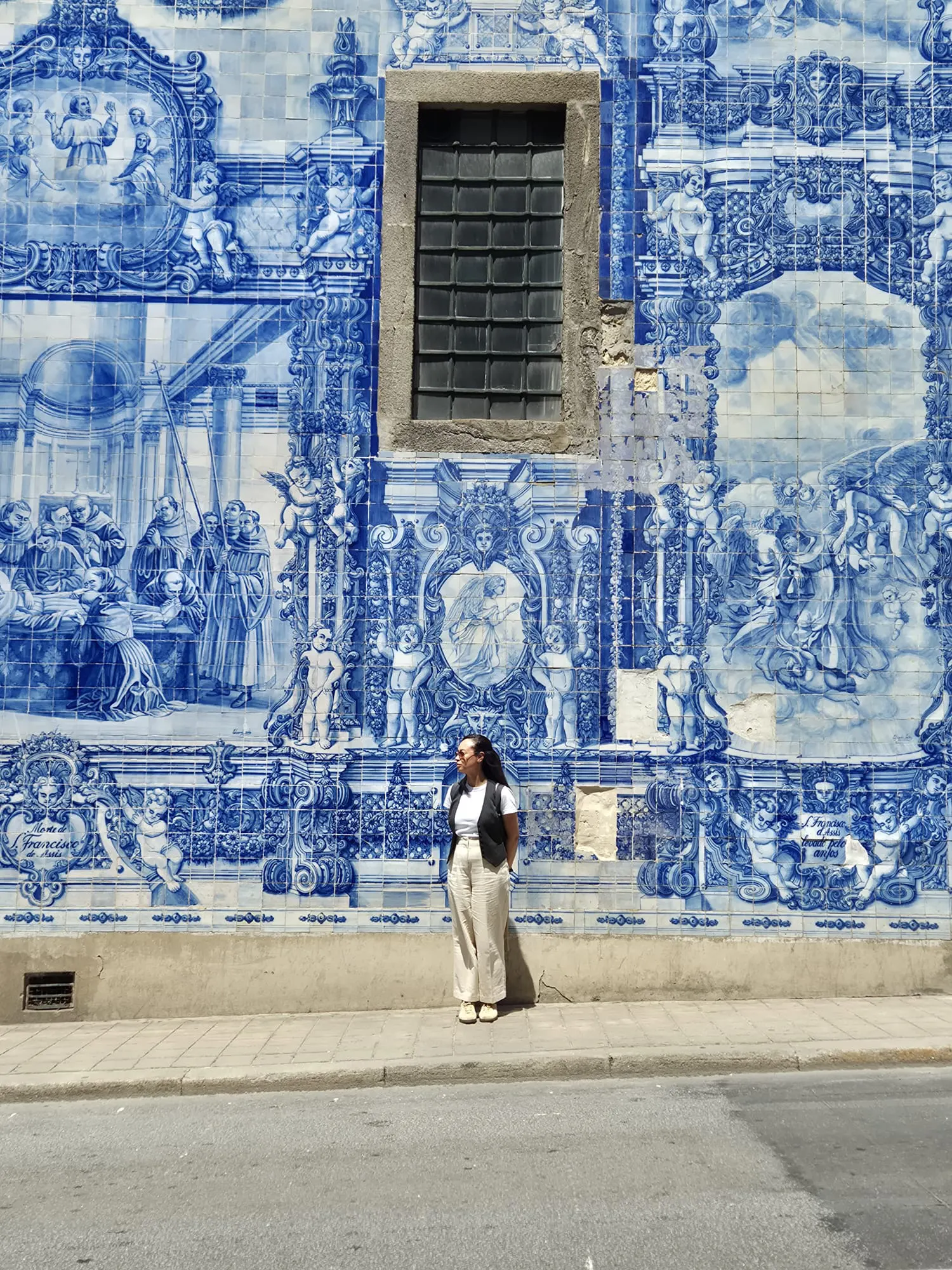 Porto in 6 days Visitor standing beside blue azulejo tiles in Porto, Portugal