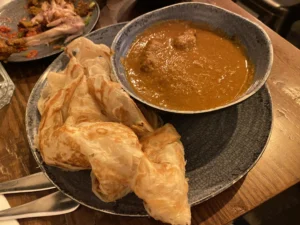 Roti canai with curry at Roti King Euston
