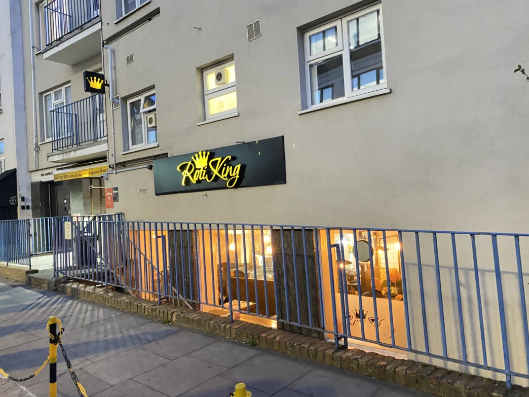 Step 10 — add alt text to all five images: Featured exterior: Entrance to Roti King Euston on Doric Way in London
