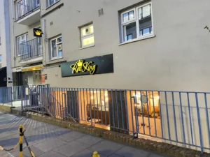 Step 10 — add alt text to all five images: Featured exterior: Entrance to Roti King Euston on Doric Way in London