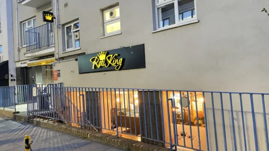 Step 10 — add alt text to all five images: Featured exterior: Entrance to Roti King Euston on Doric Way in London