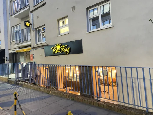Step 10 — add alt text to all five images: Featured exterior: Entrance to Roti King Euston on Doric Way in London