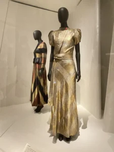 Gold Schiaparelli dress displayed at the V&A Fashion Becomes Art exhibition