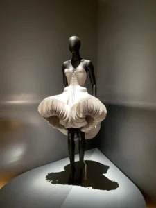 White sculptural Schiaparelli dress displayed at the V&A exhibition