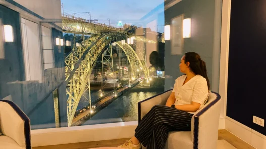 Dinner beside a panoramic window overlooking Dom Luís I Bridge at Ponte de Ferro Restaurant