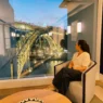 Dinner beside a panoramic window overlooking Dom Luís I Bridge at Ponte de Ferro Restaurant